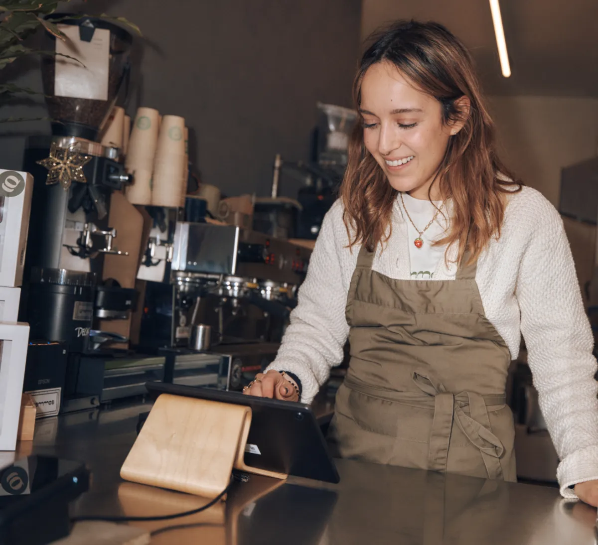 Lady smiling processing an order.