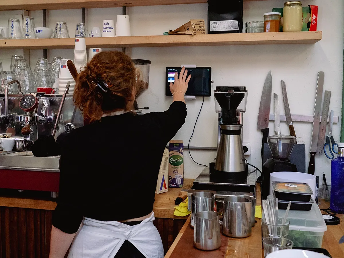 Lady uses Tebi point of sale
