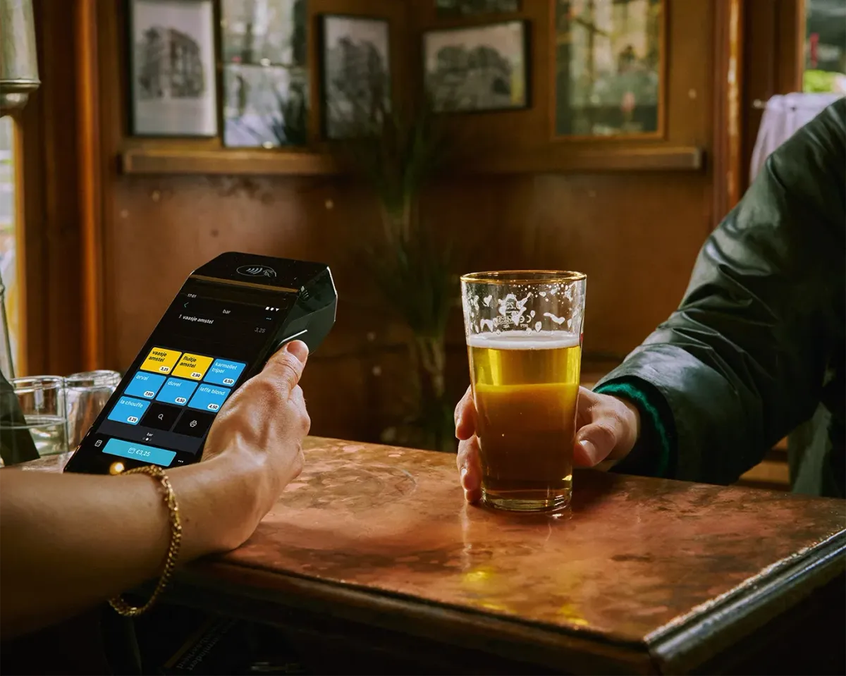 A handheld terminal being used to process a beer order.